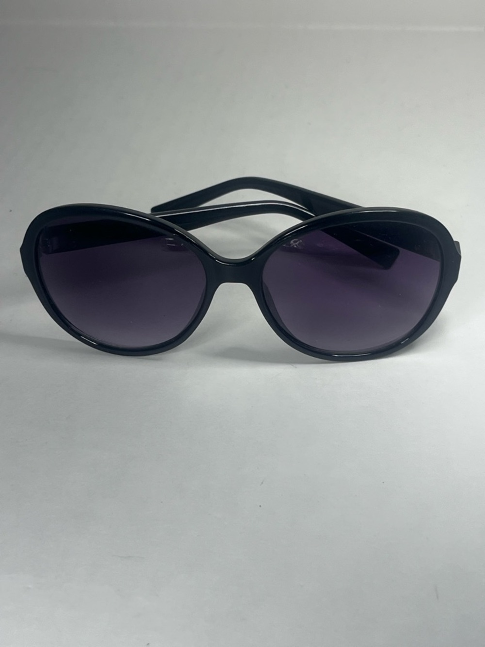 Calvin Klein Black Frame Sunglasses with Gradient Purple Lenses